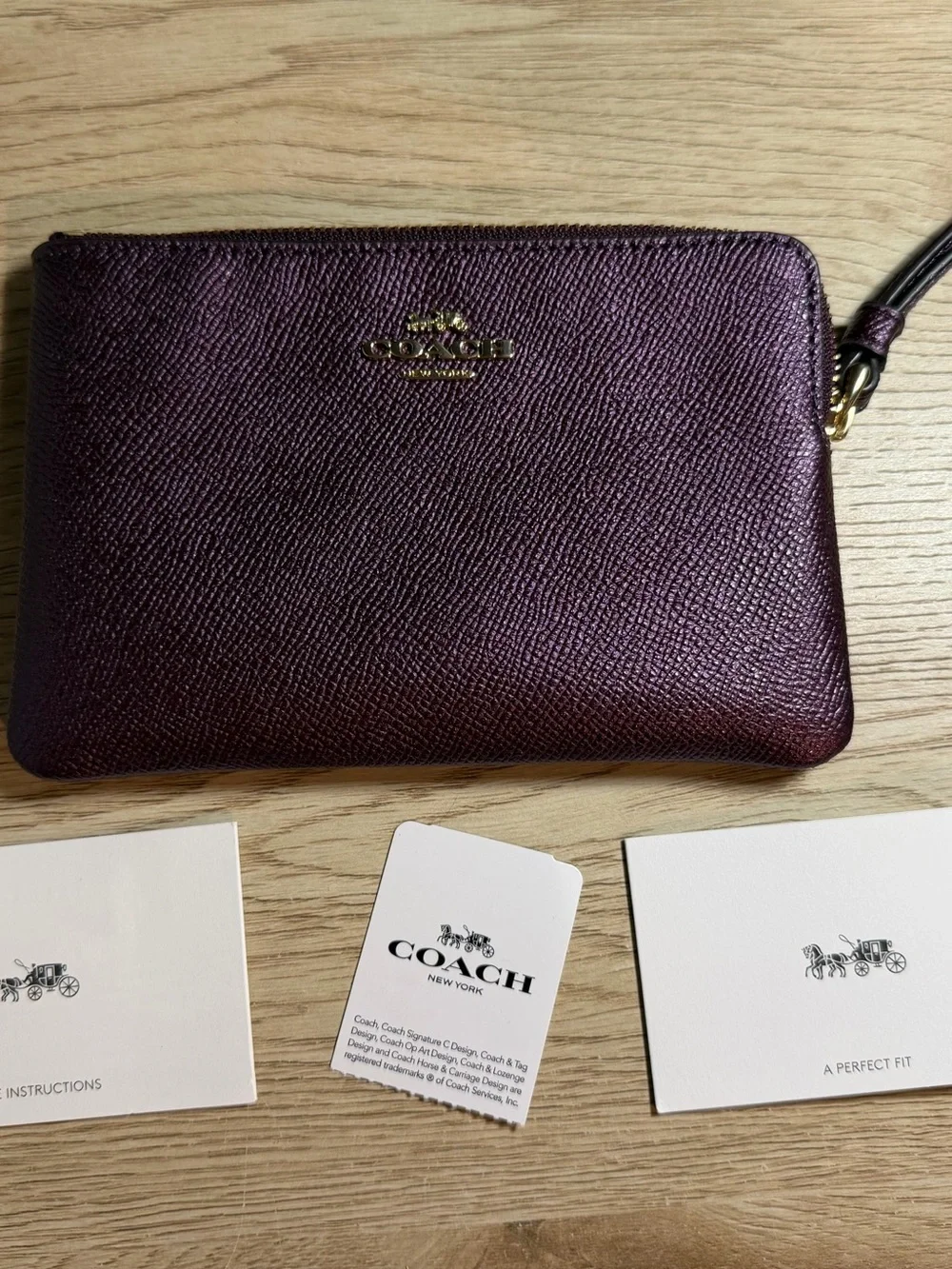 Coach Plum Metallic Leather Wristlet with Gold Hardware
